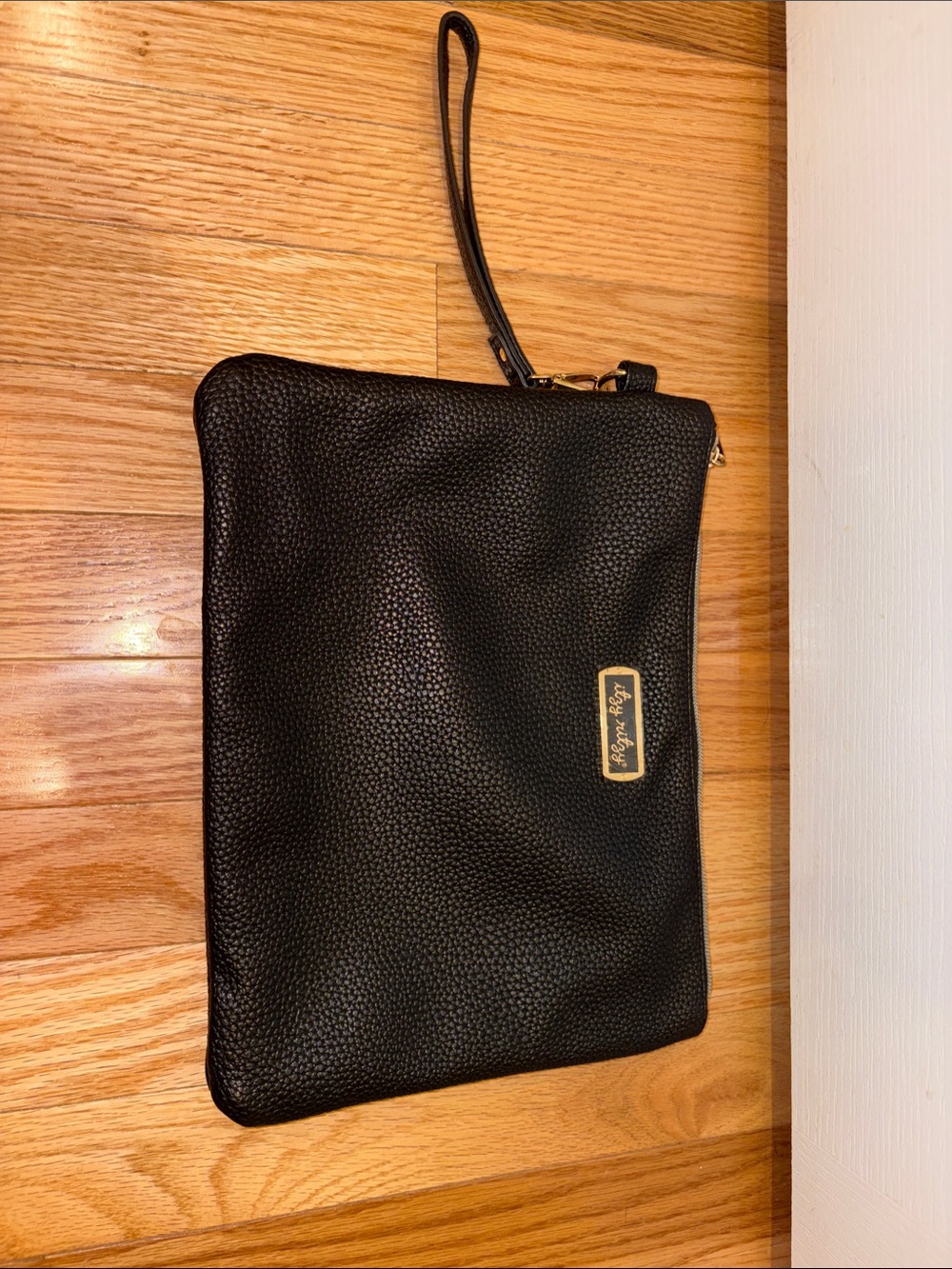 Itzy Ritzy Black Pebbled Changing Clutch with Gold Accent